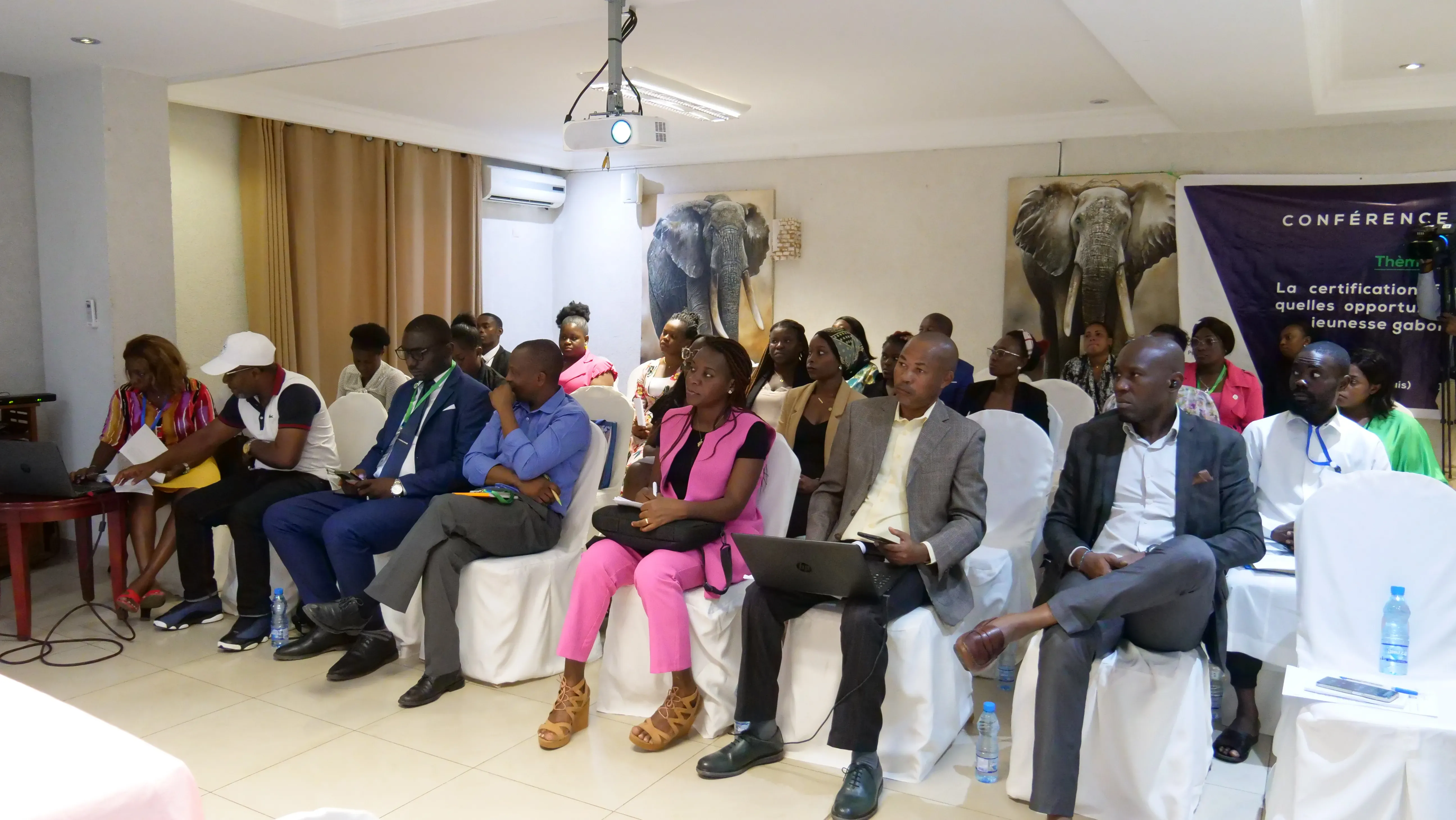 attendees listen to a conference in Libreville, Gabon