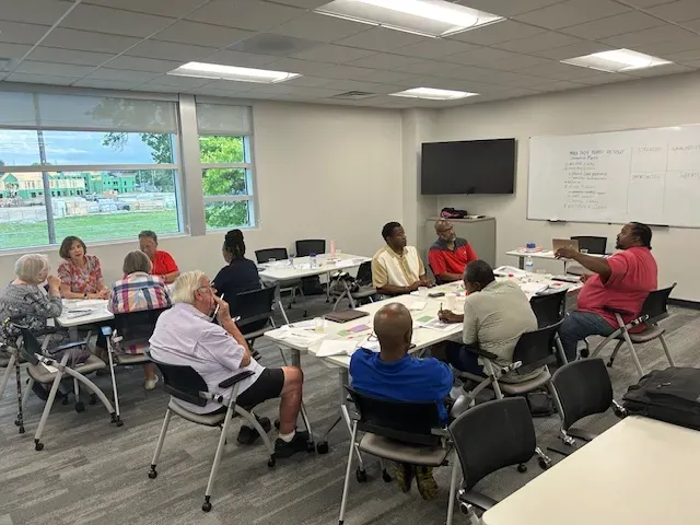educators sit in a classroom during a training session