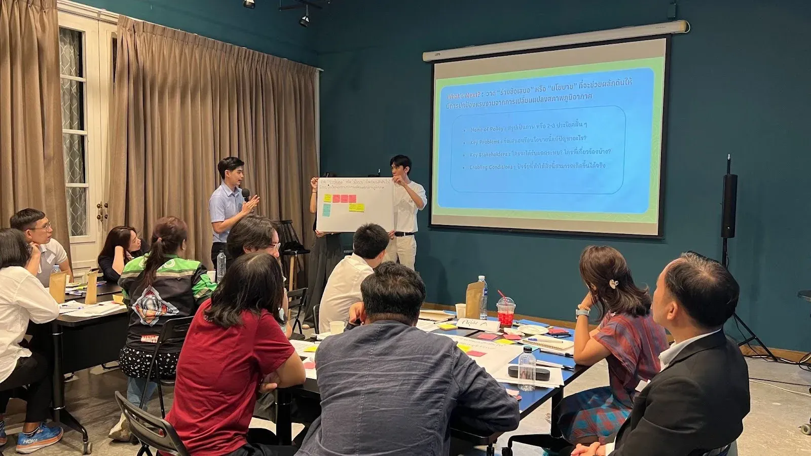  A participant is presenting existing policies or the lack thereof in safeguarding workers against the impact of climate change.