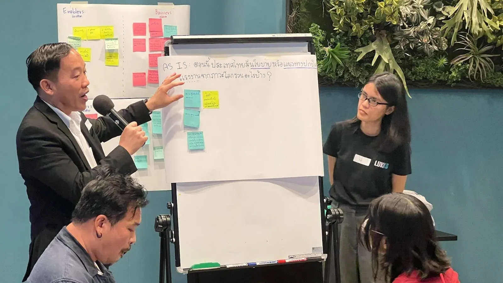 A participant is presenting existing policies or the lack thereof in safeguarding workers against the impact of climate change