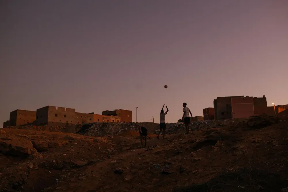 Sahrawi boys go home to Laayoune, the unofficial capital of Western Sahara, after an afternoon of playing football in the Sahara desert. 