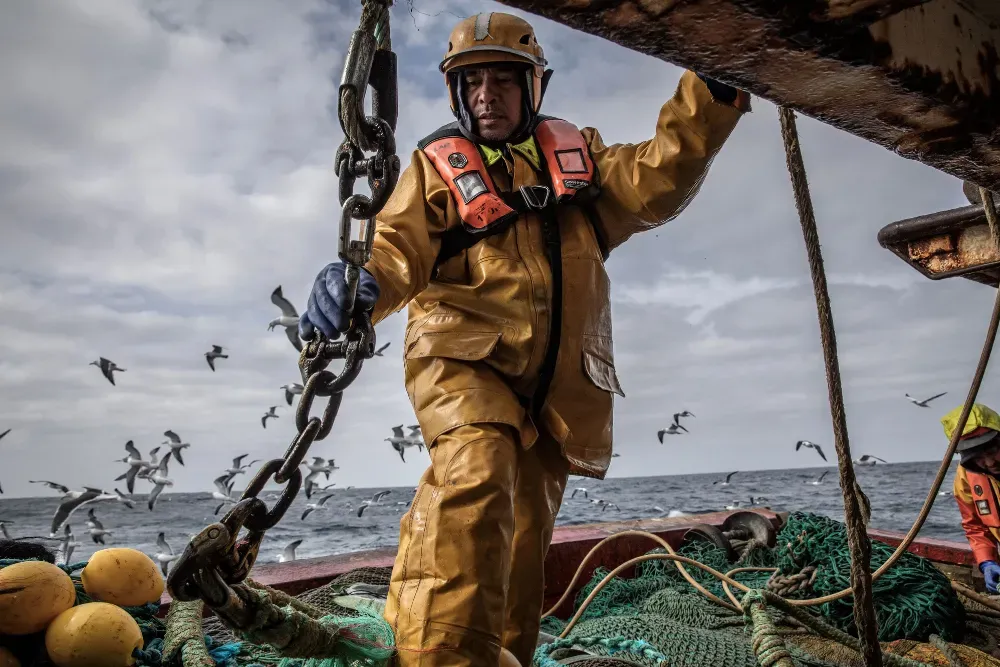 Ship engineer Larry Bantaculo handles a net aboard the fishing vessel Aquila on the ship’s final voyage in Ireland. The Aquila was being scrapped as part of Ireland’s controversial government decommissioning scheme to reduce by about 30% the number of Irish fishing boats operating in local waters. Already hammered by overfishing, the increased price of fuel and energy, inflation, geopolitics, and climate change, the Irish fishing industry is at risk of collapse due to changes in trade rules triggered by Bre