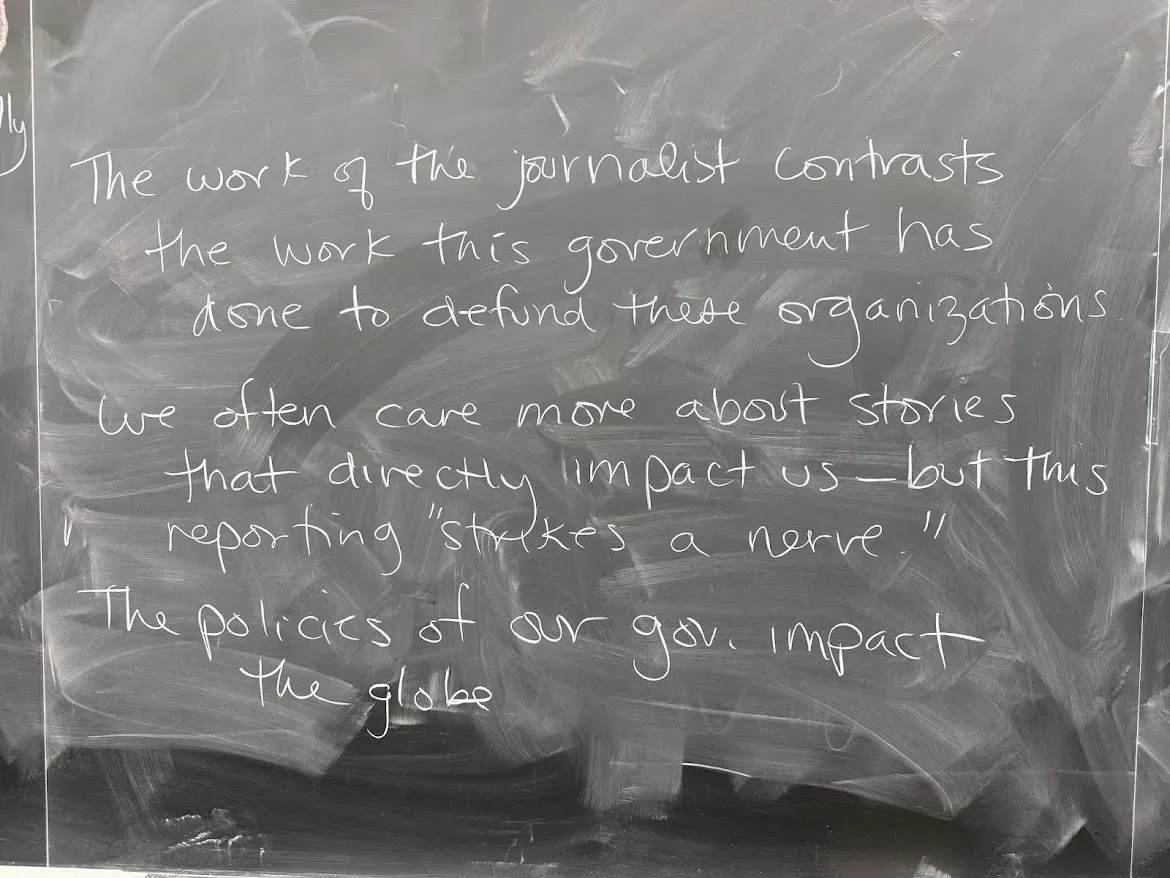 quote written on blackboard describing the work of journalists