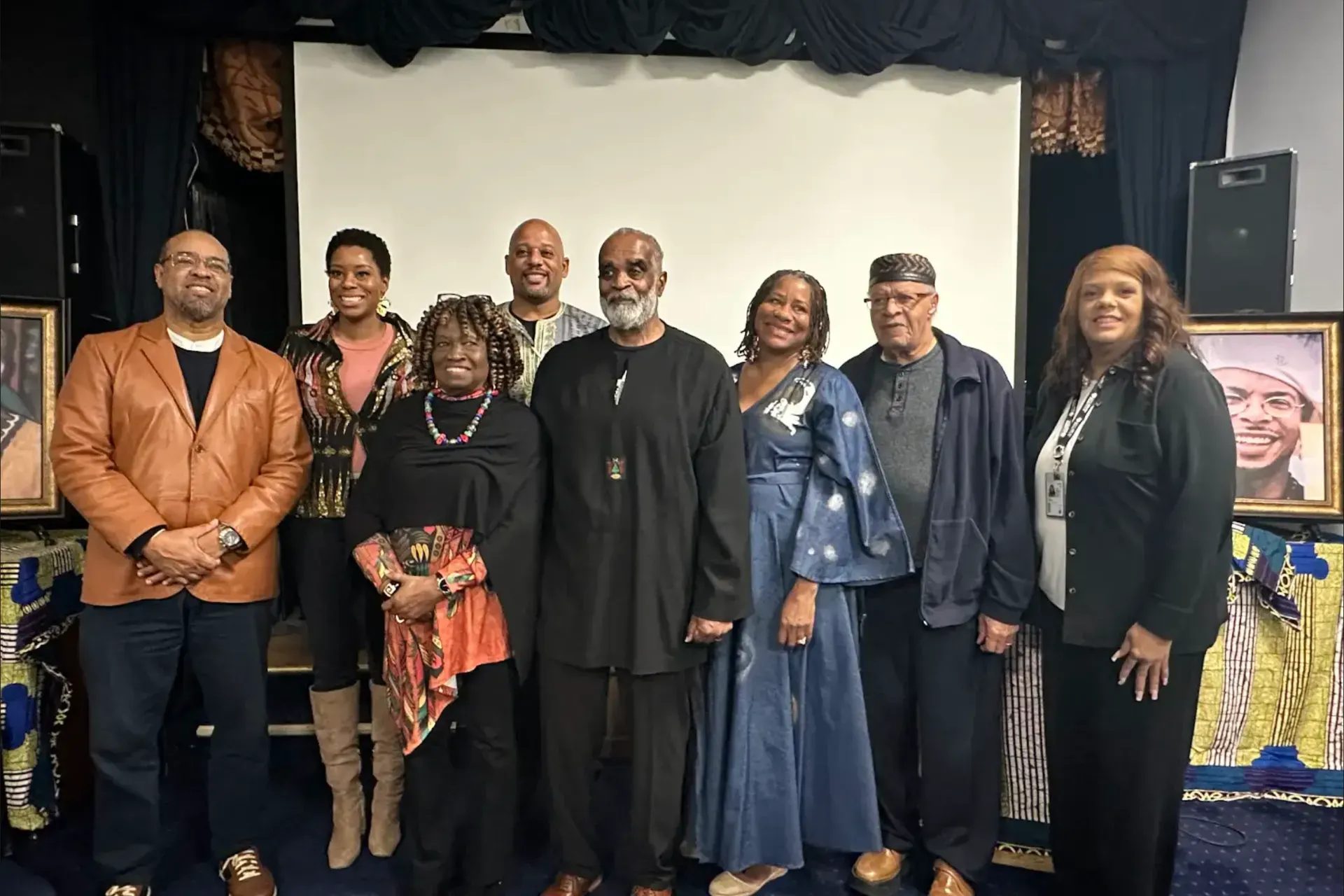 Project Lead, Veronica Jones, and 7 other speakers and collaborators posed for a group photo following the symposium event. 
