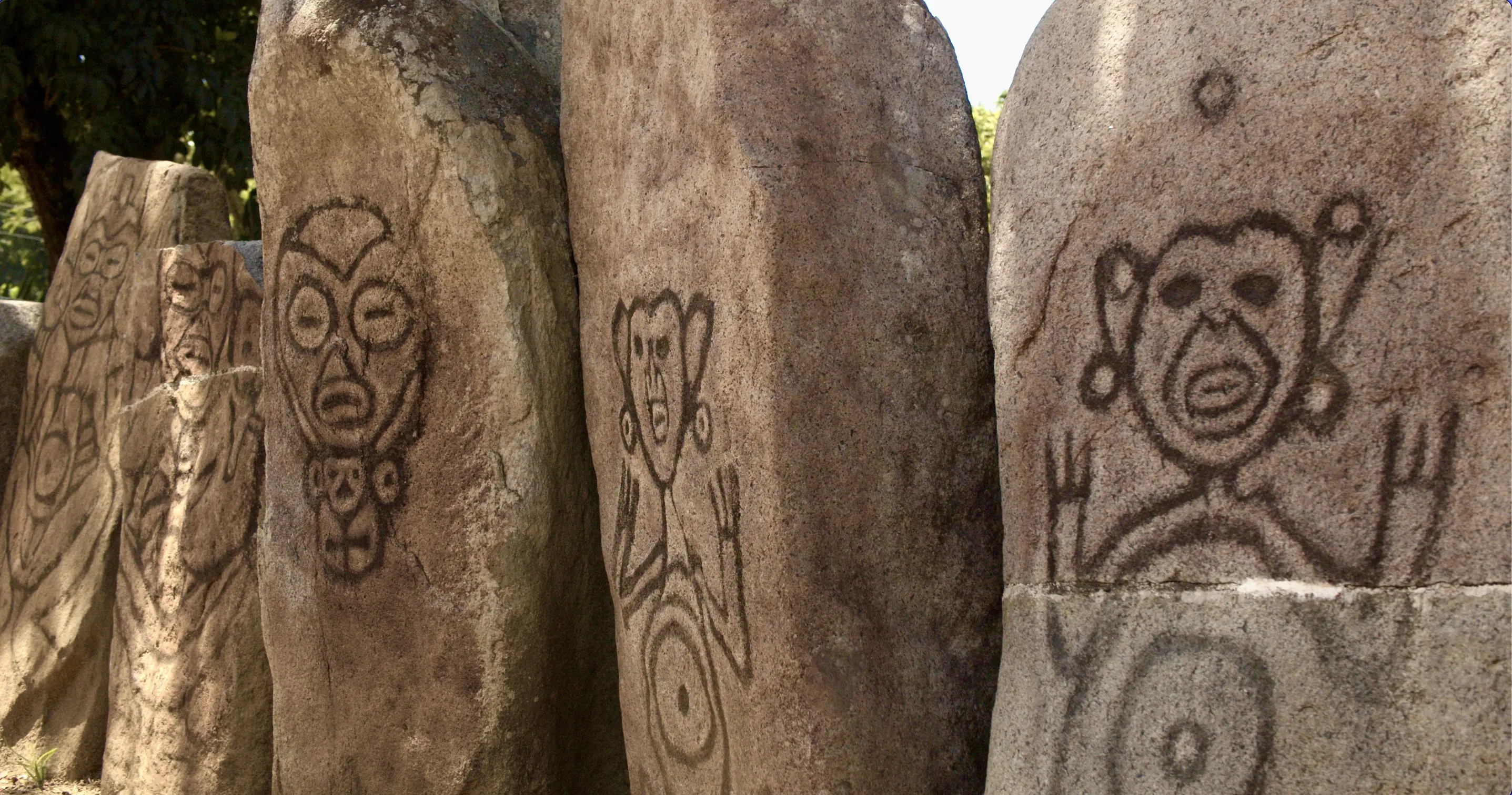Portraits of the cemis on thick stone slabs