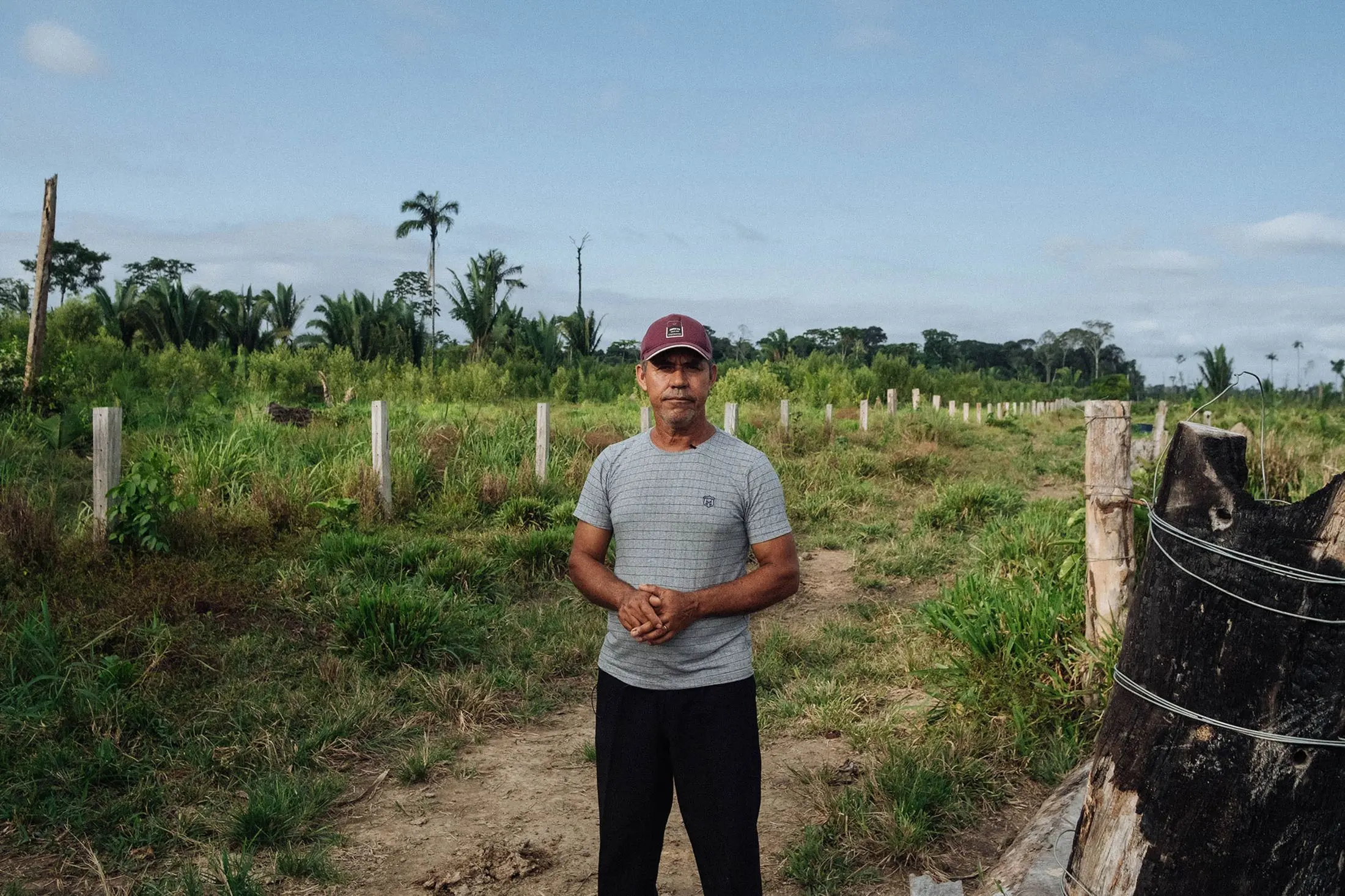 Man stands in front of his land