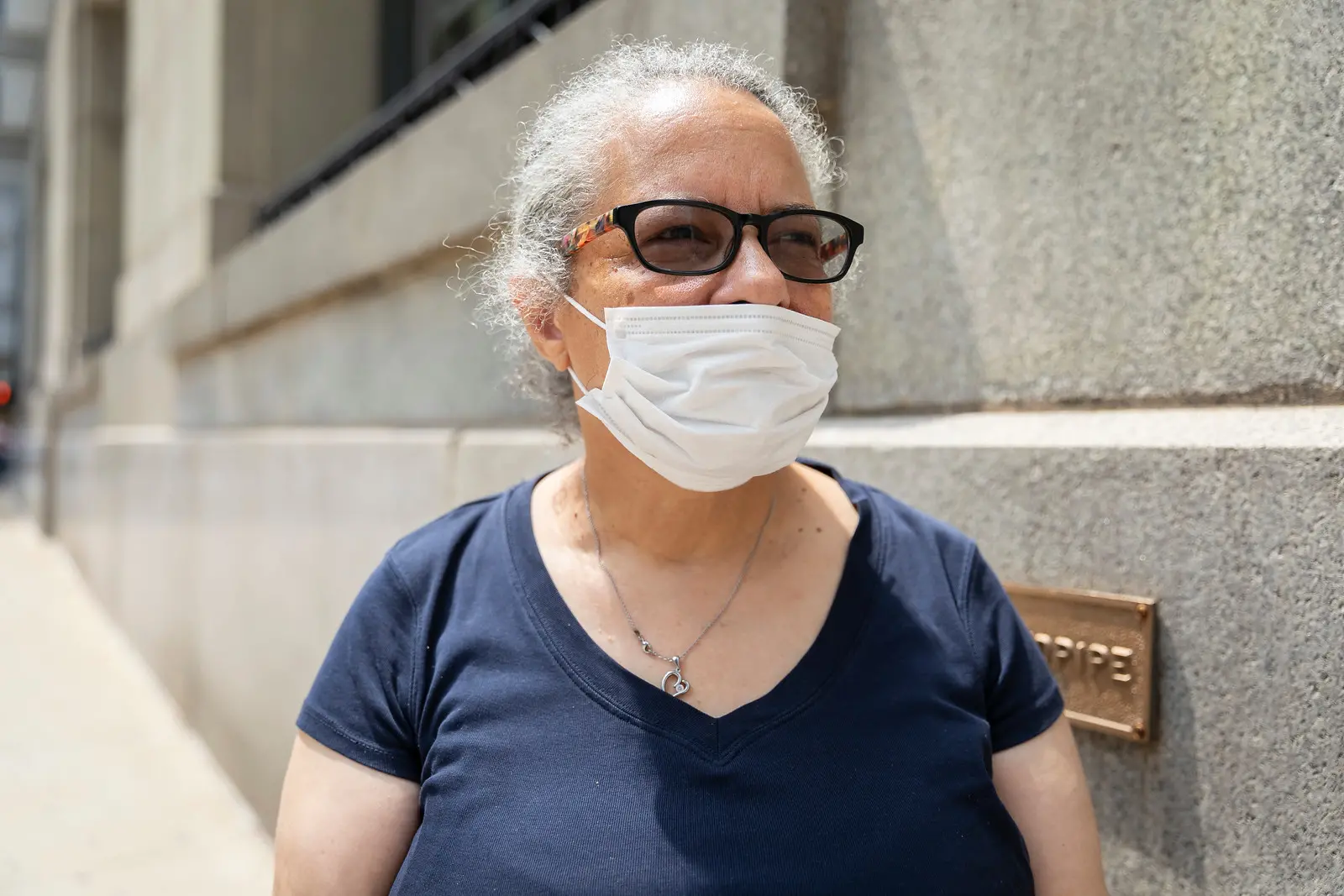 woman poses for a photo in mask