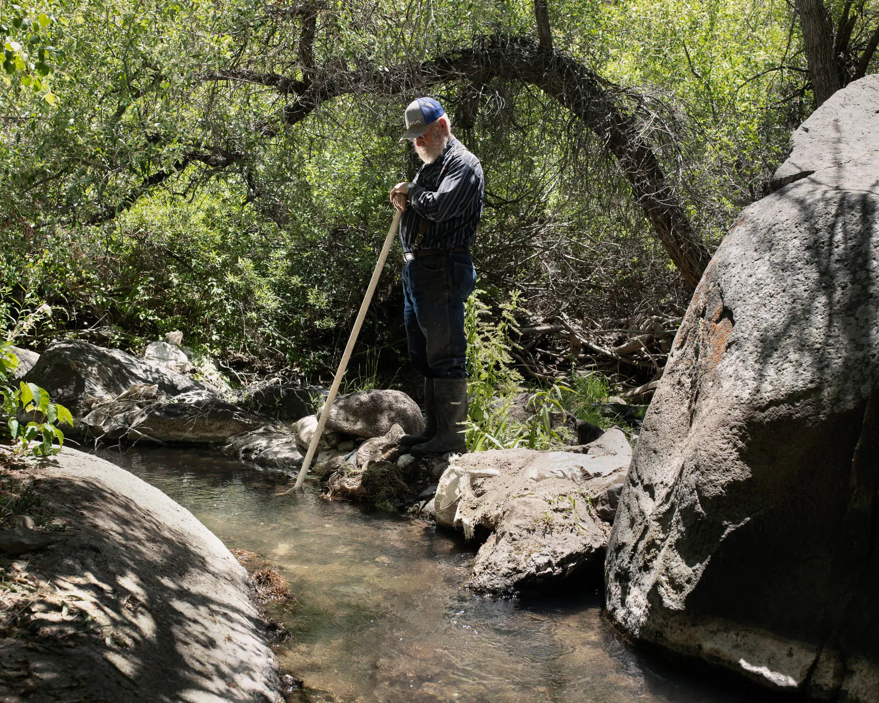 a man stands by river