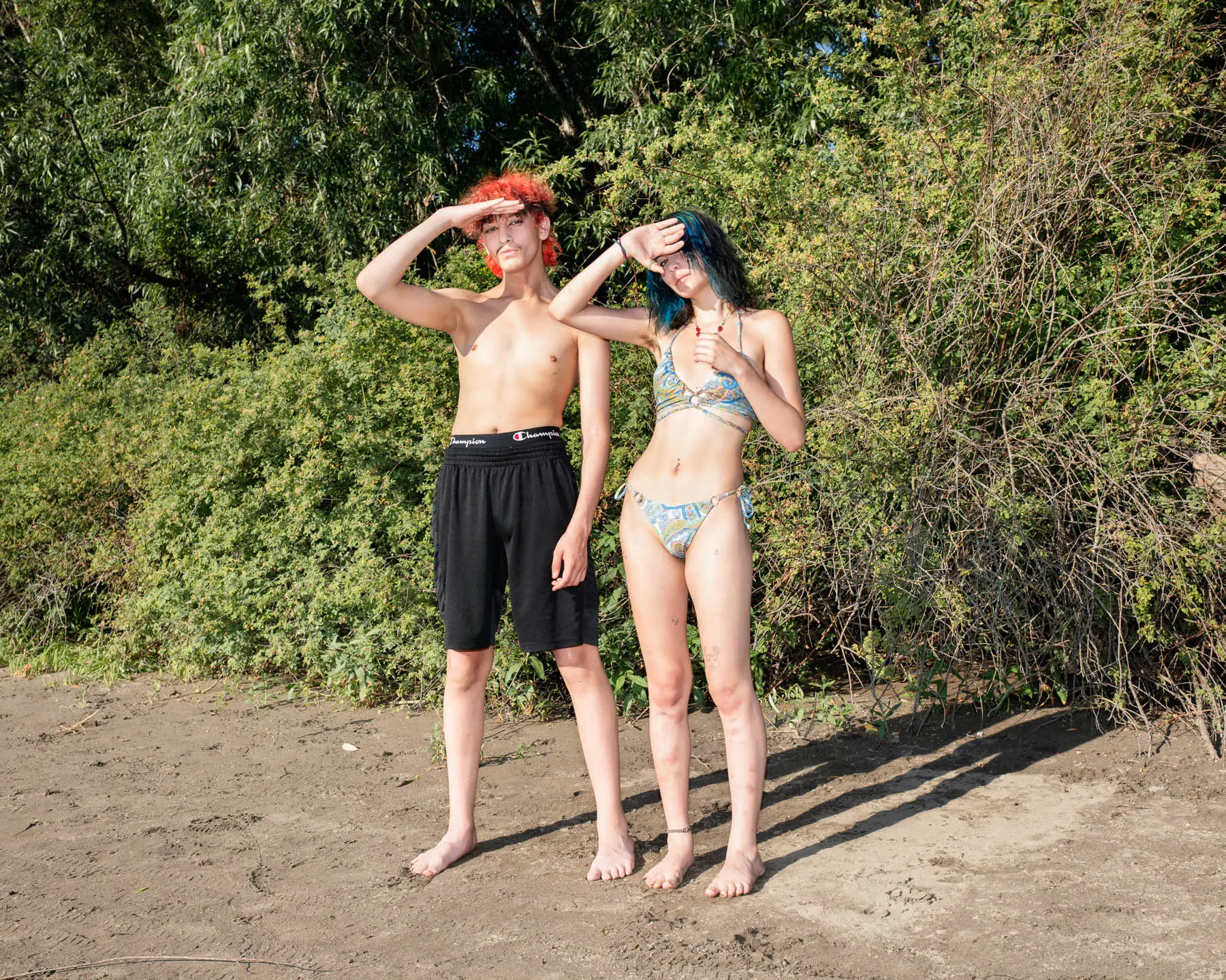 Two teens in swimsuits