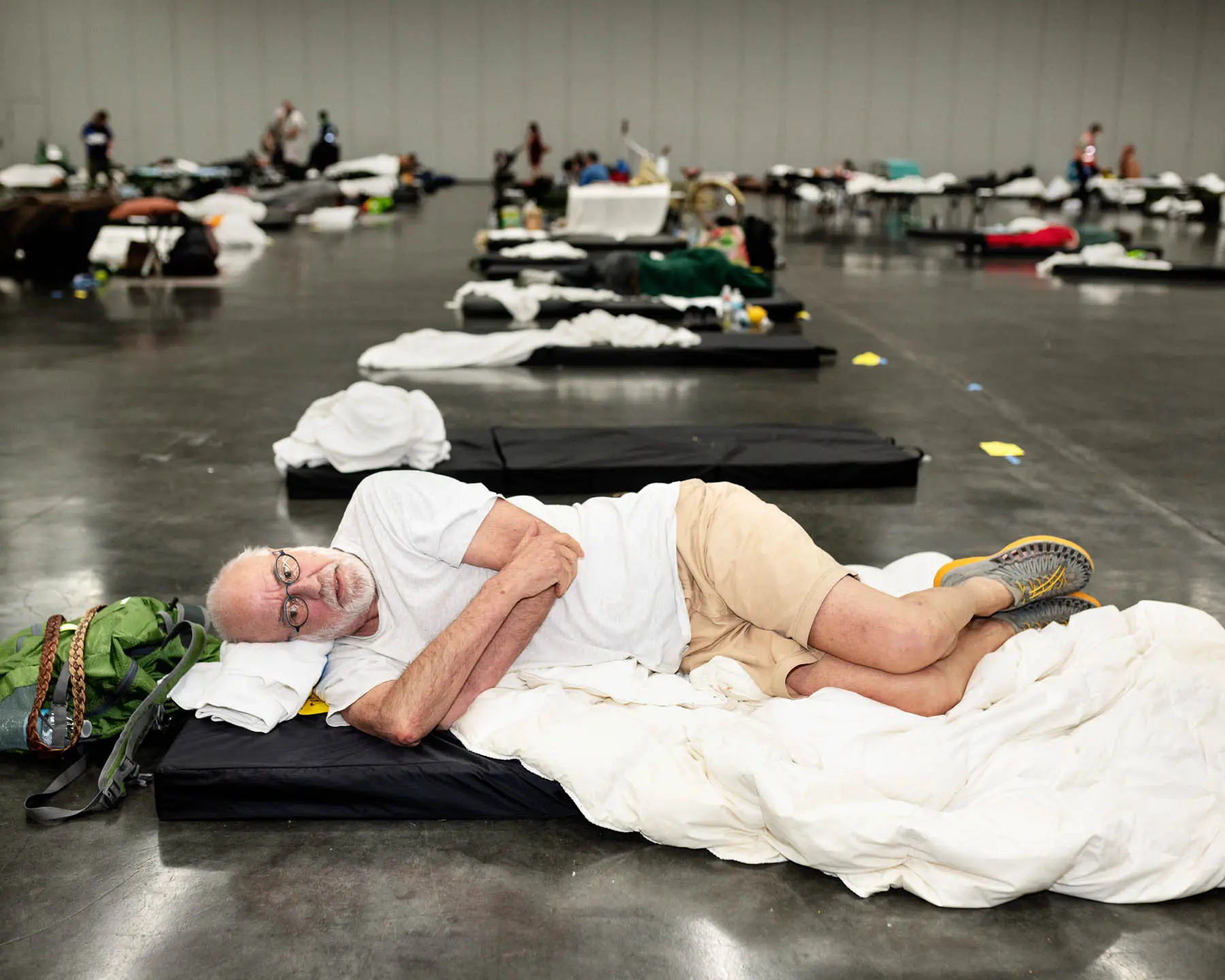 man lays on a matress