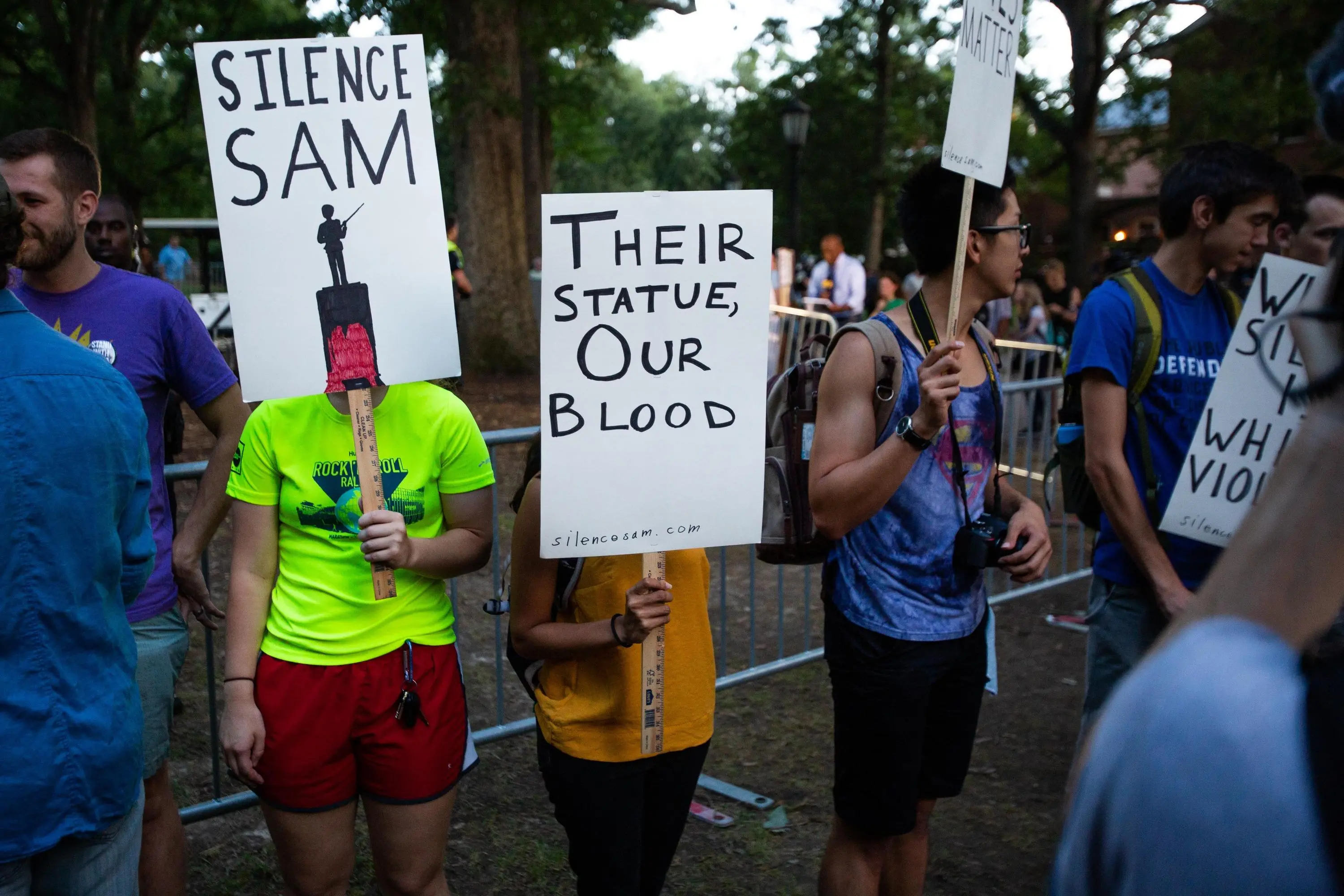 Students hold signs protesting the Silent Sam statue in Chapel Hill, North Carolina. 