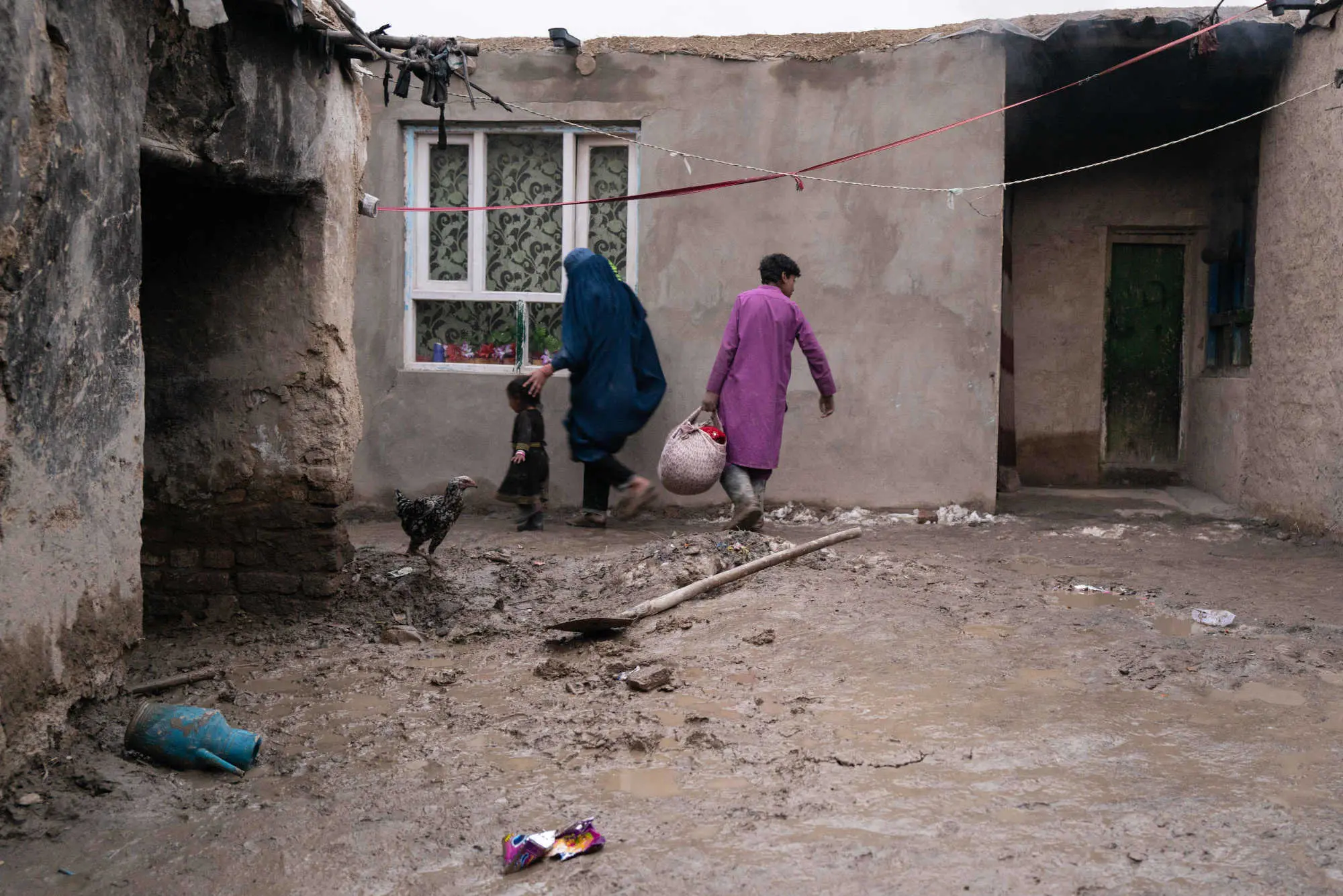A family walks with groceries 