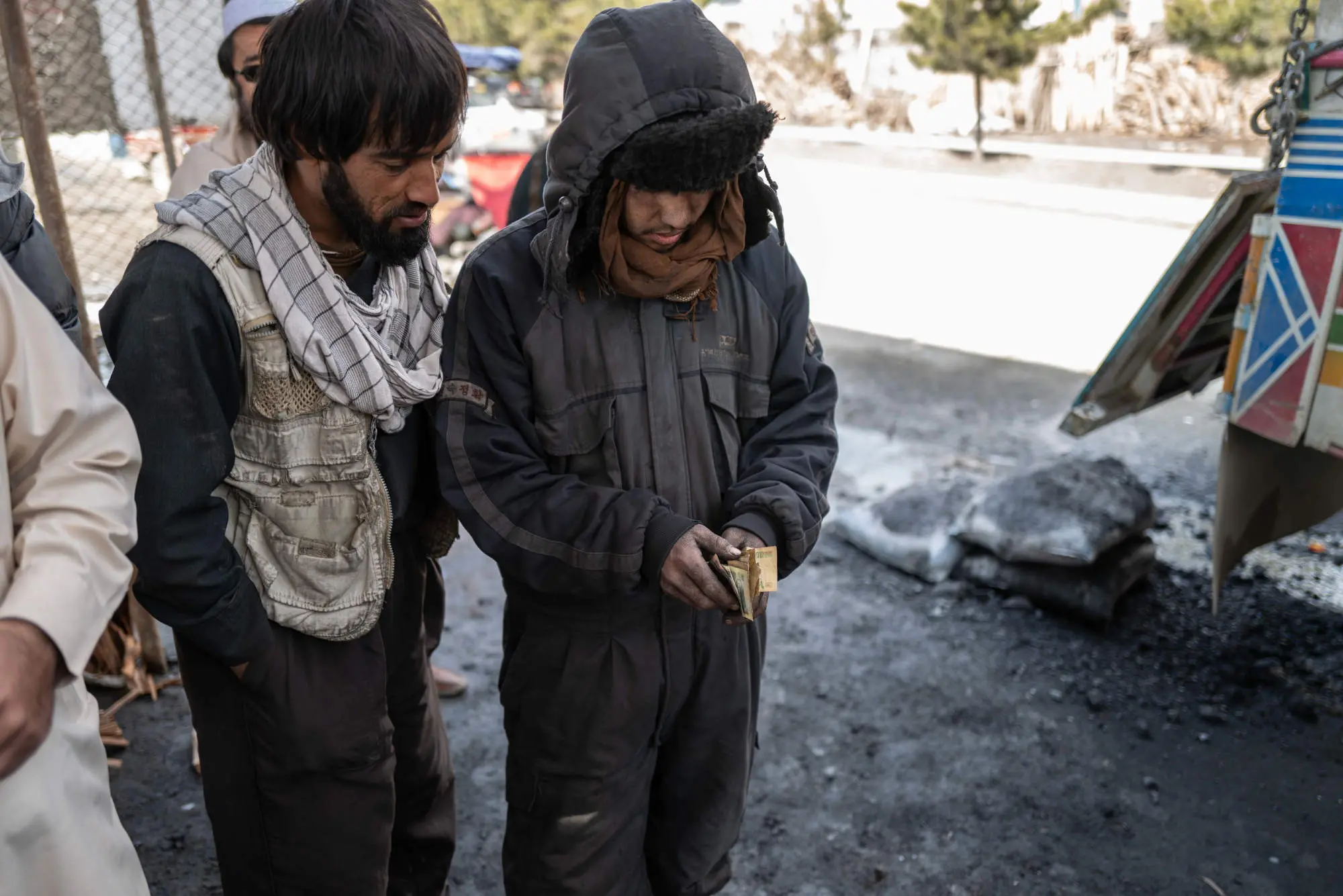 A man purchases coal from another man