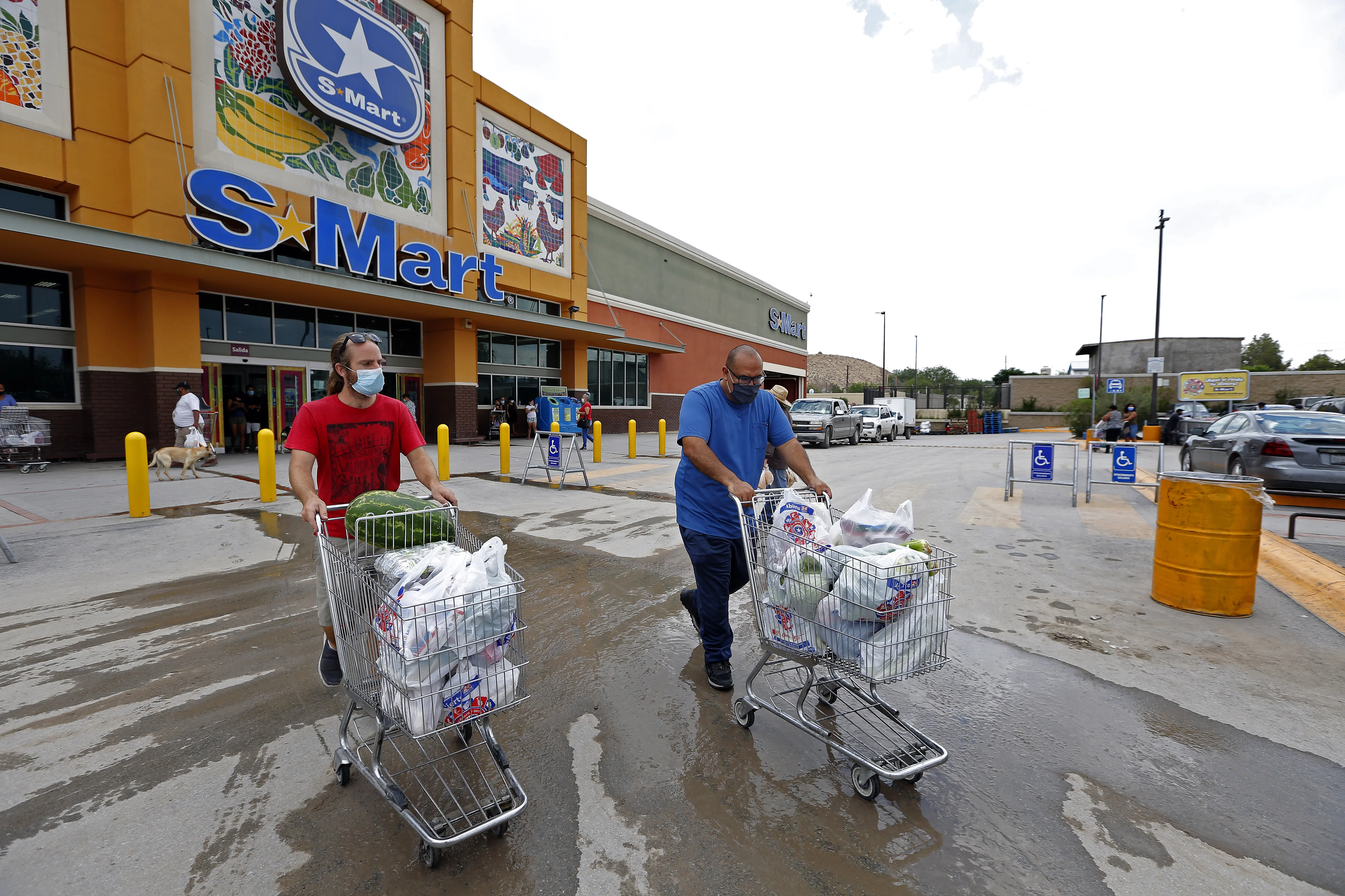 Chris Treadwell adn Juan Ortiz leave a supermarket