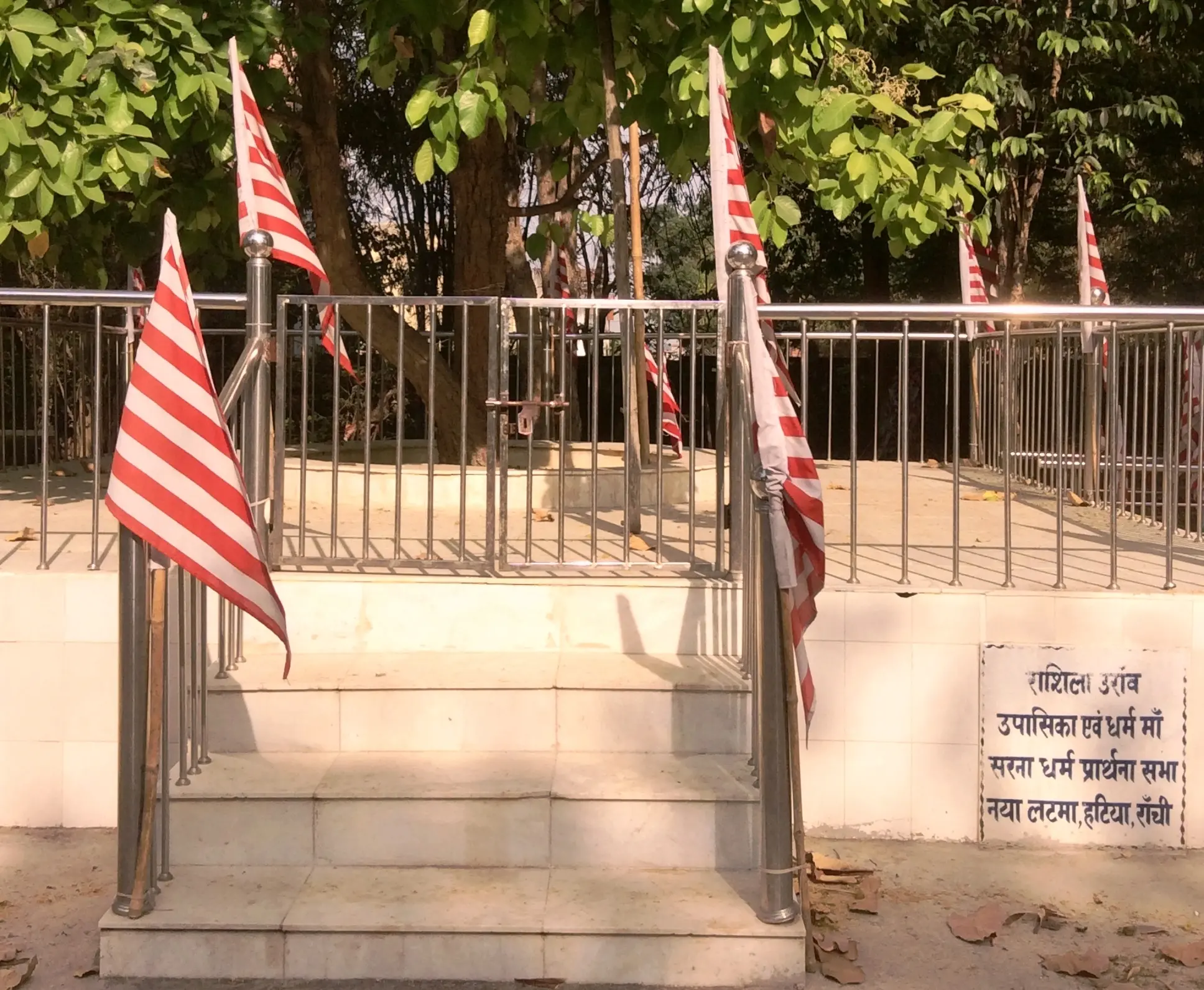 Flags hang on metal railings 