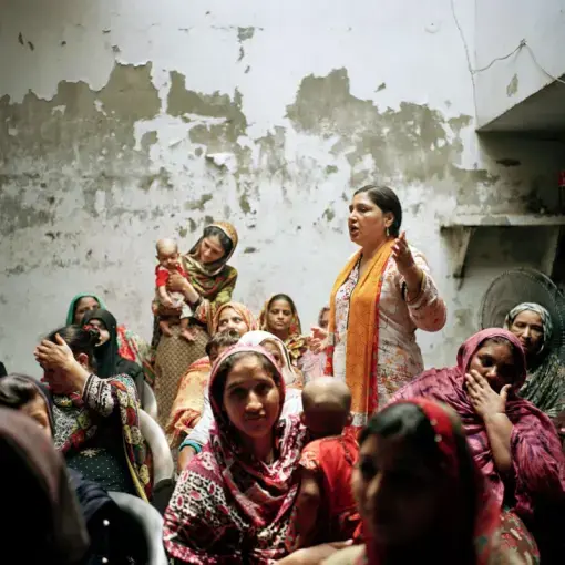 Days before Pakistan’s general elections, 50-year-old activist and human rights defender Bushra Khaliq encouraged rural women to vote. A longtime campaigner for women’s rights and labor rights, Khaliq has survived social and state-level attacks on her work. In 2017, the Ministry of Interior and home department of Pakistan accused Khaliq’s organization of performing “anti-state activities.” Khaliq took her case to the Lahore High Court and won the right to continue working. Image by Sara Hylton/National…