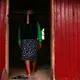 Karina Garcia&nbsp;Ríos, who calls herself 'Mujer Medicina,' or medicine woman, walks into the ceremonial room in her home in Pucallpa.&nbsp;Image by Natalie Hutchison. Peru, 2017.
