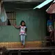 Karina's nieces, Angi and Sophia, in their home where the city meets the jungle in Pucallpa.&nbsp;Image by Natalie Hutchison. Peru, 2017.