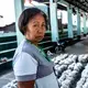 Reggie Renen, a volunteer health worker, rests after packing relief goods for the community. Image by Xyza Bacani. Philippines, 2020.