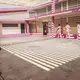 A group of female detainees warm up before exercising under guard inside Ana Maria Campos II Prison, Maracaibo, a “closed” prison — or a center for “feminine formation,” as authorities call it. Image by Ana María Arévalo. Venezuela, 2018. 