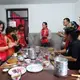 'Fold and pinch, fold and pinch,' repeats Samrakshak Samuha Nepal (SASANE) worker Shanti Guroong. As part of the Sisterhood of Survivors program, trafficking survivors teach visitors to make momos, the Nepali staple dish, while gaining skills in speaking English and in hospitality. Image by Nicole Brigstock. Nepal, 2018.