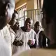 Tolton speaks with Ugandan pastors after a church service.&nbsp;Image by Jake Naughton. Uganda, 2017.