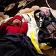Dina Marroquín’s eight-day-old baby rests next to a knapsack holding an indoor air monitor—part of study being done by an international research team to determine whether the use of gas stoves improves air quality and the health of children. Image by Lynn Johnson. Guatemala, 2017.