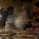 It’s lunchtime at the shelter inside Iglesia Embajadores de Jesús at Cañón del Alacrán. Migrants from Venezuela, Haiti and Central America live there. Image by Erika Schultz. Mexico, 2019.