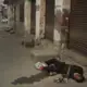 In this Oct. 31, 2019, photo, an Indian drug user lies unconscious by the side of a road in Kapurthala, in the northern Indian state of Punjab. Mass abuse of the opioid tramadol spans continents, from India to Africa to the Middle East, creating international havoc some experts blame on a loophole in narcotics regulation and a miscalculation of the drug’s danger. Punjab, the center of India's opioid epidemic, was among the latest to crack down on the tramadol trade. Researchers estimate about 4 million Indians use heroin or other opioids, and a quarter of them live in the Punjab, India's agricultural heartland bordering Pakistan. Image by Channi Anand / AP Photo. India, 2019.