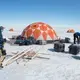 University of Montana glaciologists Joel Harper and Toby Meierbachtol assemble the gear they're using to measure the movement of the ice sheet. Image by Amy Martin. Greenland, 2018. 