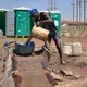 A zama zama processes gold and says he works seven days per week to feed his family. Image by Mark Olalde. South Africa, 2017.