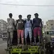 African migrants make their way to work in Marib, Yemen, July 29, 2019. Migrants often interrupt their journey to finds jobs to make extra money. Image by AP Photo / Nariman El-Mofty. Yemen, 2019.