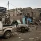 Yemenis make their way, Aug. 4, 2019, on a road in Dhale province, where African migrants cross to continue their journey through Yemen - and an active frontline between Houthi rebels and militiamen backed by the Saudi-led coalition. Image by AP Photo / Nariman El-Mofty. Yemen, 2019.