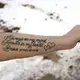 Amy Fischer shows a tattoo that she got after her son Brian, 33, died by suicide in 2016. “I had someone ask me the other day, ‘Does it get any easier?’” Amy said about her grieving, tears forming in her eyes. “I said, ‘It gets easier to cover it.’” Image by Coburn Dukehart / Wisconsin Watch. United States, 2020.