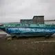 Isolated boat staying on the shore nearby Kaktovik. Image by Nick Mott. United States, 2019.