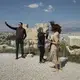 Syrian refugee, Taima, takes photographs among other tourists while visiting the Acropolis in Athens. Image by Lynsey Addario. Greece, 2017.