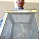 Steve Mulligan, district manager of the Consolidated Mosquito Abatement District, holds a container with&nbsp;Aedes aegyptimosquitoes during a news conference at the Fresno County Department of Health in July 2016. Image by John Walker / The Fresno Bee. United States, 2016.
