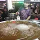 A vendor sells tea-flavored gelatin, a local favorite especially during Taiwan's tropical summer heat. Image by Melissa McCart. Taiwan, 2018. 