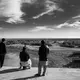 Fishermen at a small port in Sistan, Iran, are looking into the dried Hamoon lake, once the livelihood of the local fishermen. After 10 years of drought, people lost their jobs and most immigrated to larger cities. Image by Ako Salemi. Iran, 2016.