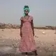 In this July 15, 2019 photo, 15-year-old Willo, a migrant from Ethiopia, poses for a portrait as she and others rest on the last stop of their journey before leaving by boat to Yemen in the evening, in Obock, Djibouti. Image by Nariman El-Mofty / AP Photo. Djibouti, 2019.