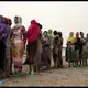 Ethiopian Tigray migrants stand in line as they are counted by smugglers after crossing the Bab el-Mandeb strait from Djibouti to the coastal village of Ras al-Ara in Lahj, Yemen, July 25, 2019. Image by AP Photo / Nariman El-Mofty. Yemen, 2019.