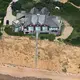 A mansion was perched precariously near Great Island trail off Chequesset Neck Road in Wellfleet. Image by John Tlumacki. United States, 2019.