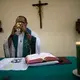 Father Amaro Lopes partakes in the sacrament while celebrating a mass in a chapel at the bishop’s house in Altamira. Image by Spenser Heaps. Brazil, 2019.