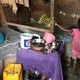 The inside of Telfort Innocent’s shack at the biggest camp in Village Caradeux in Delmas turns into a river whenever it rains. Ten years after Haiti’s 2010 earthquake, he and his children are among thousands who call the camp home. Image by Jose A. Iglesias. Haiti, 2019.