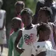 A group of children checks out visitors at the Teren Toto camp in Haiti. Image by Jose A. Iglesias. Haiti, 2019.
