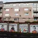 A mural painted by youth from Y Sort It, meant to inspire positivity in the neighborhood, on sealed-off garages, Clydebank. Image by Michael Santiago. United Kingdom, 2019.