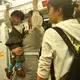 A young woman carrying her son on the train in Shanghai.&nbsp;Image by&nbsp;Argentina Maria-Vanderhorst. China, 2018.