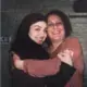 Zahra Ahmad hugs her mother Lamiya Mahdi, who she calls Mama, before leaving to Iraq. Image courtesy of Ahmad family. United States, 2019.