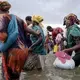 Ethiopian migrants disembark from a boat on the shores of Ras al-Ara, Lahj, Yemen, July 26, 2019, after being smuggled across the Bab el-Mandeb strait from Djibouti. Loaded into a 50-foot-long open boat in darkness, the migrants were warned not to move or talk during the eight-hour crossing. Most had never seen the sea before. Image by AP Photo / Nariman El-Mofty. Yemen, 2019.