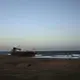 This Feb. 10, 2018, photo shows a shipwreck abandoned on the shore from Mocha to Aden in Yemen. On the beach, old pleasure venues also lie empty, broken and deserted due to the civil war here. A shattered night club and a vacant children’s theme park are ghostlike reminders of generations past. Image by Nariman El-Mofty. Yemen, 2018. </p>
<p>